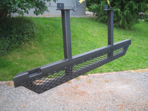 1989 Ford Bronco - Aftermarket steel running boards with mesh inserts are shown, ready for installation.