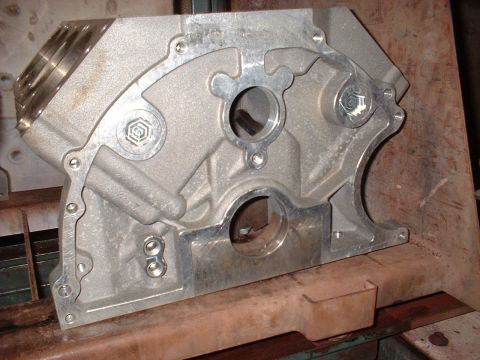 1970 Ford Mustang - Close-up view of an aluminum engine block, a hexagonal logo and machined surfaces.