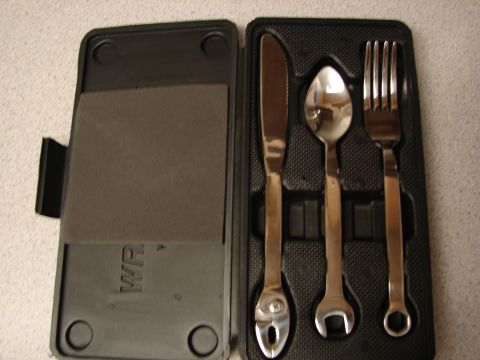 1992 Ford Taurus - A set of cutlery with handles designed to resemble wrenches is displayed in a black carrying case.
