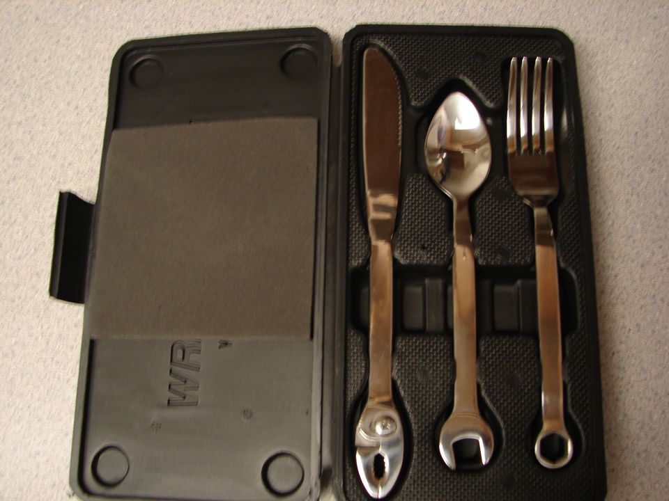 Novelty wrench-handled knife, spoon and fork in a black molded tool-style case