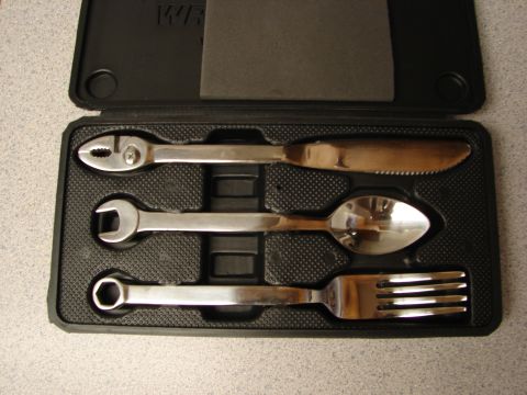 1992 Ford Taurus - A tool kit contains a wrench, pliers, knife, spoon, and fork, not a 1992 Ford Taurus.