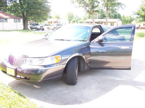 1998 Lincoln Town Car - Door open to show dark level of tint. 20 up front, 50 on rear, and stock on front and rear windshields. Eventually going to just remove it…
