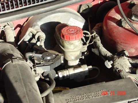1997 Dodge Neon - The brake fluid reservoir and master cylinder are visible in the engine bay.