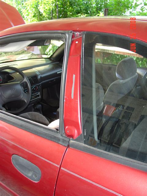 1997 Dodge Neon - Interior view of a 1997 Dodge Neon, captured from the driver's side door.