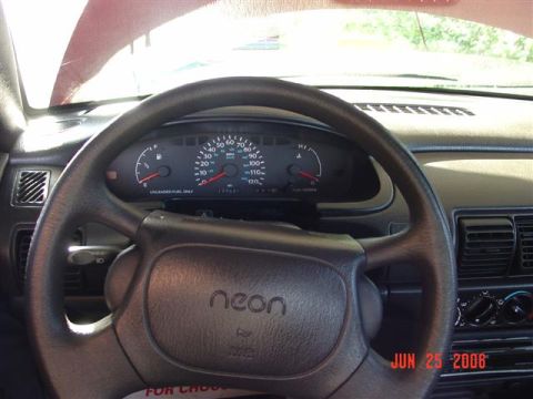 1997 Dodge Neon - Interior view of a 1997 Dodge Neon, showing the steering wheel and instrument cluster.
