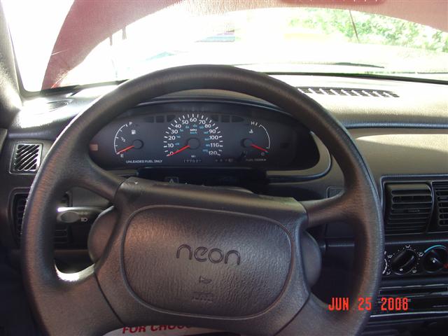 1997 Dodge Neon interior with steering wheel and dashboard gauges visible