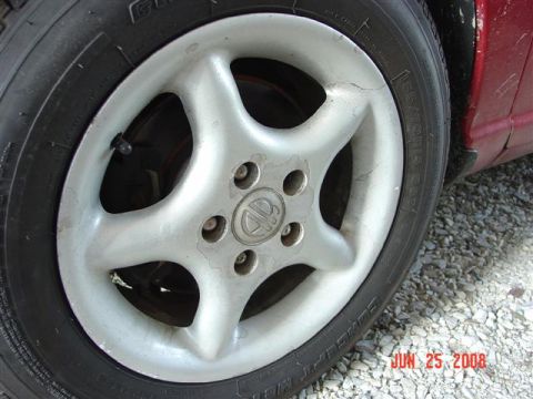 1997 Dodge Neon - A close-up view of a car's wheel and tire, with a date stamp in the corner indicating it was taken on June 25, 2008.