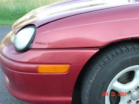 1997 Dodge Neon - Close-up of the front passenger side of a red 1997 Dodge Neon, with a watermark indicating the photo was taken on June 25, 2008.