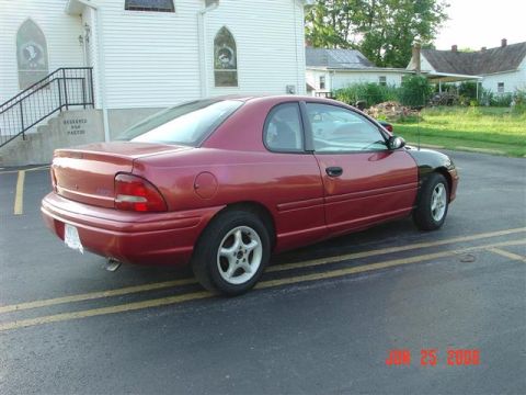1997 Dodge Neon - This 1997 Dodge Neon coupe is shown from a 3/4 front angle, a distinctive black fender.