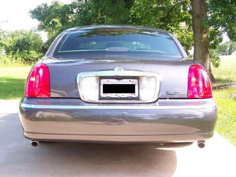 1998 Lincoln Town Car - Rear end pic w/ my color matched painted SCT emblem and my recently added Cartier trunk emblem. Exhaust tips are just cheap chrome tips fro…