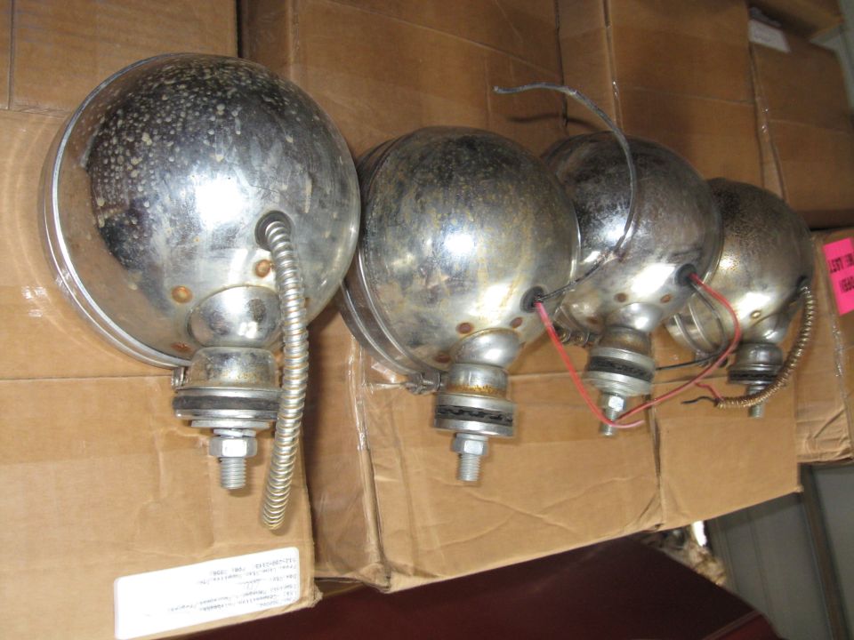 Four chrome pilot lights with visible wiring and mounting hardware