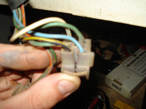 1967 Ford F-250 - Close-up of a multi-pin electrical connector with various colored wires, likely part of a vehicle's wiring system.