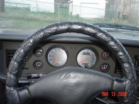 1984 Ford Mustang - The interior of a car shows the dashboard, steering wheel, and gauges, with a date watermark from 2006.