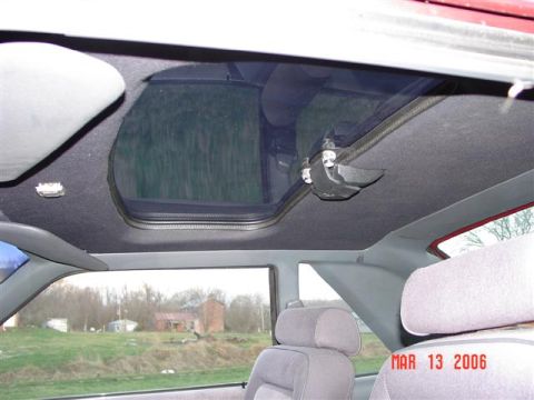 1984 Ford Mustang - The interior of a vehicle is shown, focusing on the sunroof and headliner, with a timestamp indicating March 13, 2006.
