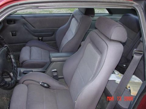 1984 Ford Mustang - Interior view of a 1984 Ford Mustang, highlighting the seats and console.