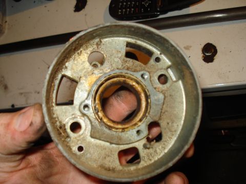 1967 Ford F-250 - Close-up of a metal steering column component, revealing its internal bearing and mounting points.