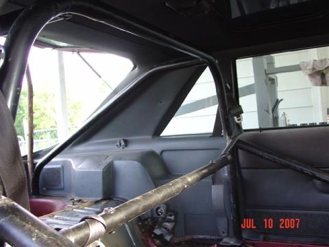 1984 Ford Mustang - The interior of a 1984 Ford Mustang shows a substantial roll cage installation.
