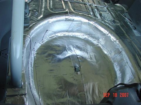 1984 Ford Mustang - The interior floor of a vehicle is covered with reflective sound deadening material, with visible cut lines and a date stamp of Sep 18, 200…