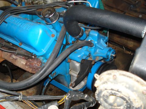 1967 Ford F-250 - Close-up view of an engine compartment, showing various mechanical components and wiring.