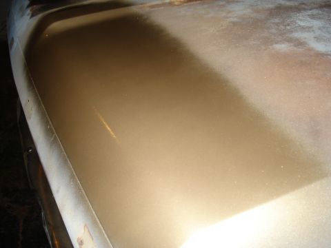 1967 Ford F-250 - Close-up of a tan interior panel, likely from a vehicle.
