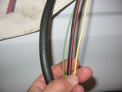 1995 Ford Bronco - believe it or not, 2GA charge cable on left (used for both + and ground), and the super wimpy 8 GA or worse black w/orange stripe stock cha…