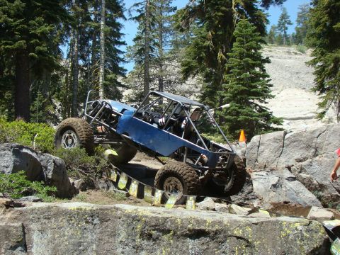 1989 Ford Bronco - Custom off-road buggy tackles a challenging rocky terrain.