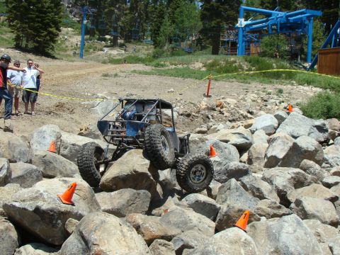 1989 Ford Bronco - Custom off-road buggy navigating a challenging rocky terrain course.