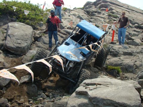 1989 Ford Bronco - Buggy attempts to climb a steep, rocky hill during an off-road event.