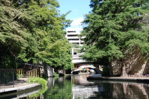 1996 Ford Bronco - A scenic view of the San Antonio Riverwalk, surrounded by greenery and urban architecture.