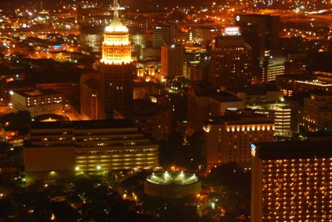 1996 Ford Bronco - Nighttime view of the San Antonio skyline, numerous illuminated buildings and city lights.