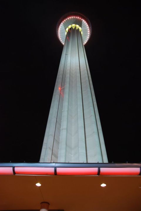1996 Ford Bronco - Tower illuminated at night with red lights on a lower structure.