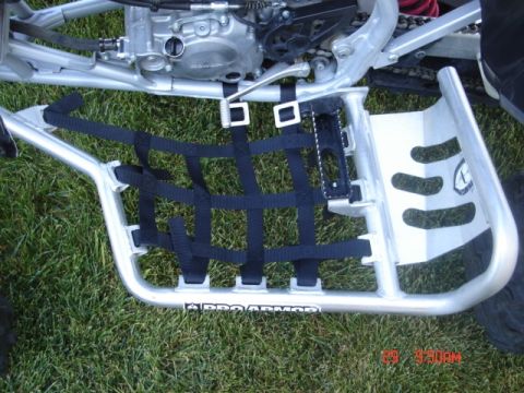 1981 Ford Bronco - Close-up of an ATV's Pro Armor footwell and engine components.