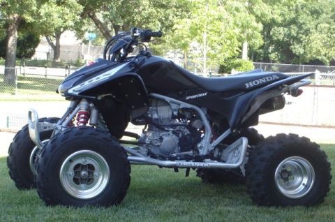 1981 Ford Bronco - This Honda ATV features a black body with silver accents and knobby tires.