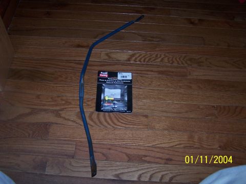 1979 Ford F-150 - A blue metal rod and a Holley performance parts kit are displayed on a wooden floor.