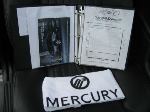 2003 Mercury Marauder - A Mercury Marauder brochure and dyno chart are displayed on car seats, along with a Mercury branded towel.