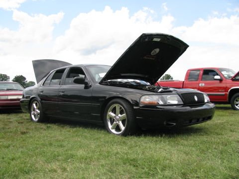 2003 Mercury Marauder - A black 2003 Mercury Marauder is displayed with its hood open at an outdoor event.