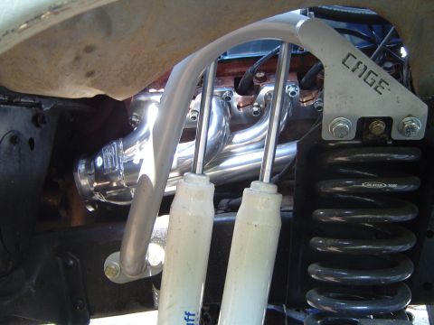 1978 Ford Bronco - Custom exhaust headers and suspension components are shown, including a roll cage bar and shock absorbers.