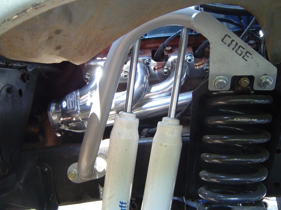 Polished tube headers, CAGE dual-shock hoop with white James Duff shocks and Deaver coil spring