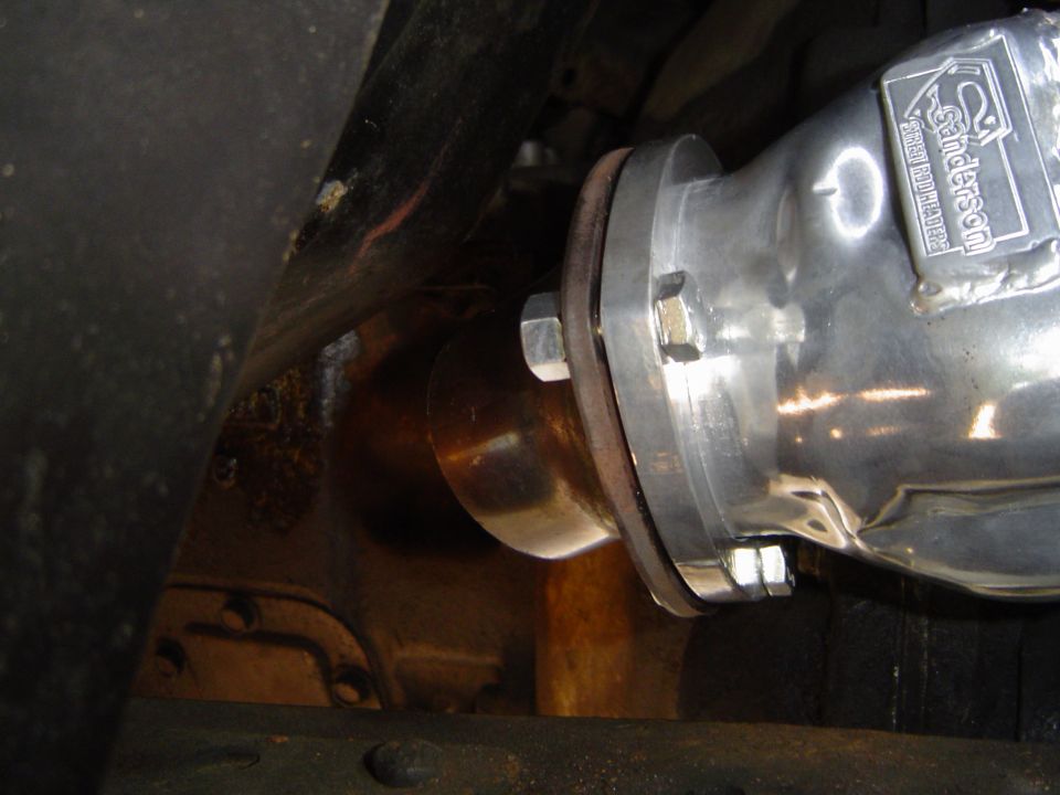 Exhaust pipe with Sanderson logo, bolted to a flange