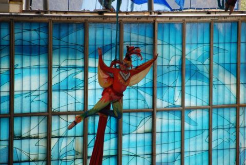 1996 Ford Bronco - An aerial performer hangs from silks against a backdrop of blue stained glass.