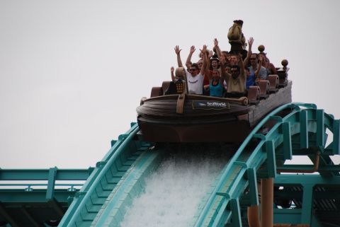 1996 Ford Bronco - A boat ride at an amusement park with passengers enjoying the descent down a water slide.