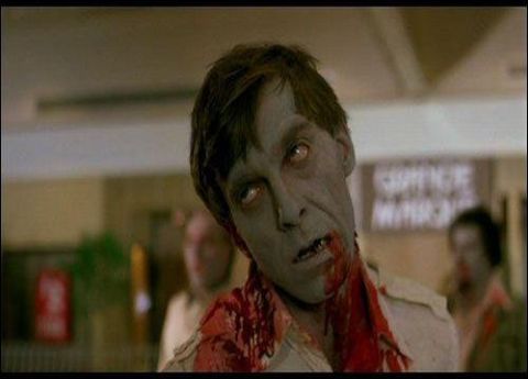 1991 Ford Crown Victoria - A zombie with pale skin and blood around its neck is the main subject of this unsettling image.