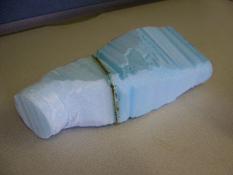 1986 Ford Bronco - A section of blue foam padding is shown, possibly from a vehicle's interior.
