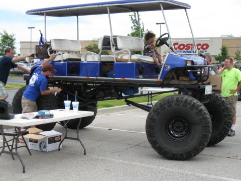 1994 Ford Bronco - This custom golf cart features massive tires and seating for multiple passengers.