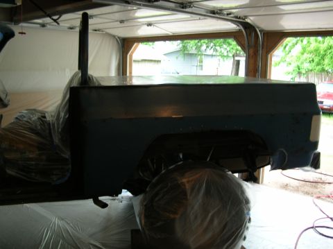1975 Chevrolet Blazer - Side view of a 1975 Chevrolet Blazer in a garage, covered in plastic for work.