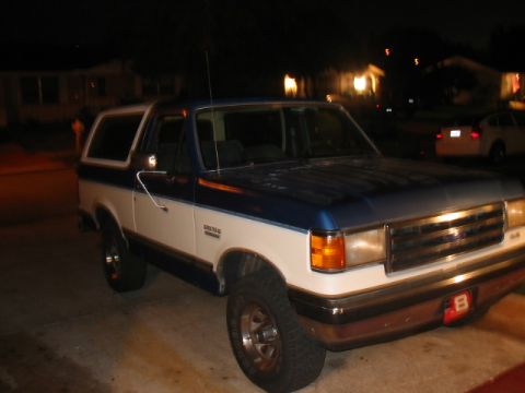 1991 Ford Bronco - This 1991 Ford Bronco is shown in a 3/4 front view at night.