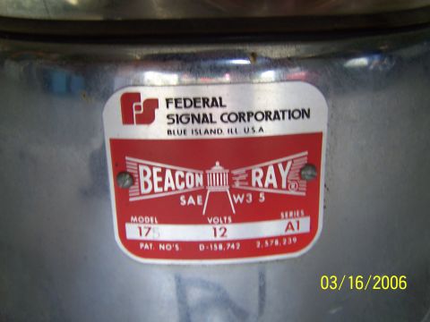 1998 Ford Crown Victoria - Label for a Federal Signal Corporation Beacon Ray Model 175, showing voltage and series information.