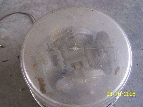 1998 Ford Crown Victoria - Headlight assembly with clear lens and visible internal components.