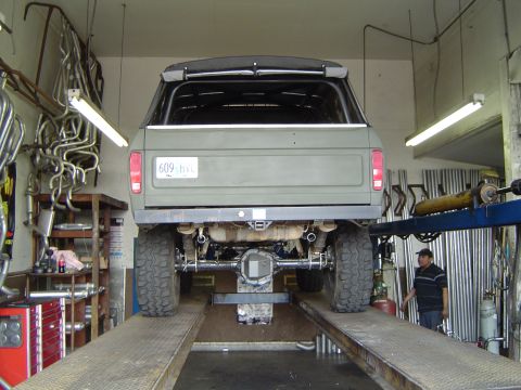 1978 Ford Bronco - This 1978 Ford Bronco is shown from the rear on a vehicle lift, with a focus on its exhaust system.