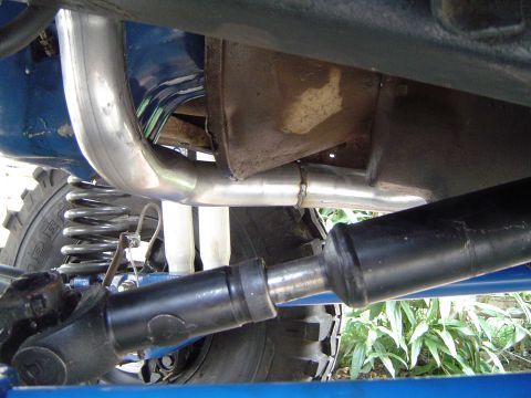 1978 Ford Bronco - Undercarriage view showing exhaust system and driveshaft, likely from an off-road vehicle.